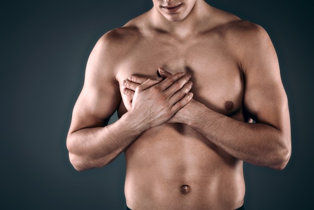 man concealing breasts